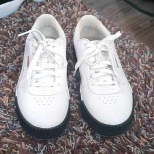 Women's pumas size 8.5 white with black soles.